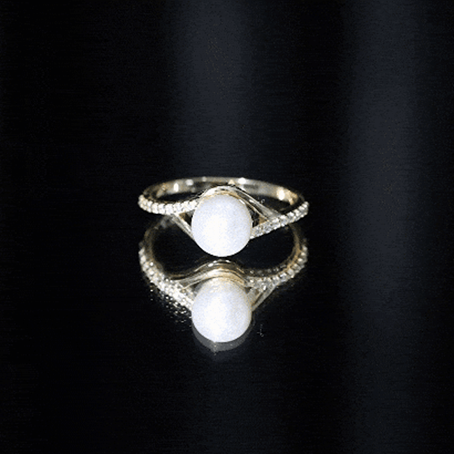 Cultured 7.4 carat freshwater pearl engagement ring with diamond split shank by Rosec Jewels, showcasing elegant design and sparkling accents.