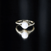 Cultured 7.4 carat freshwater pearl engagement ring with diamond split shank by Rosec Jewels, showcasing elegant design and sparkling accents.