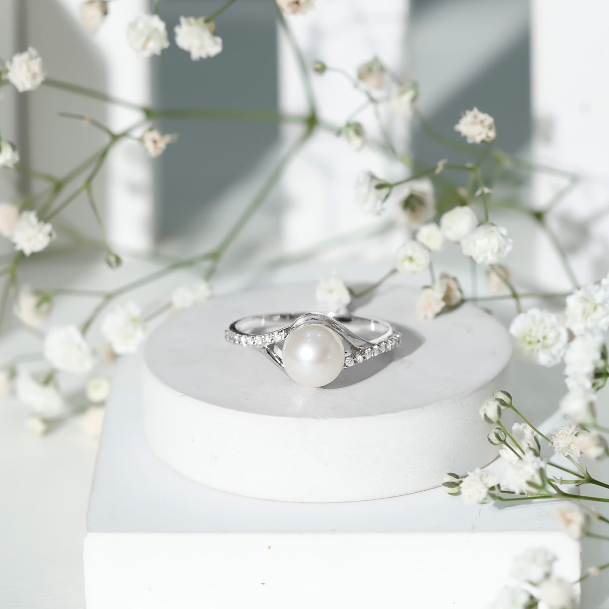 Cultured 7.4 carat freshwater pearl engagement ring with diamond split shank by Rosec Jewels, showcasing elegant craftsmanship.