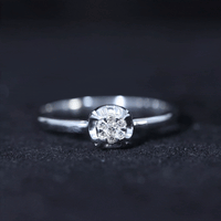 Yellow gold round shape diamond promise ring in illusion setting, featuring a sparkling central diamond and elegant band.