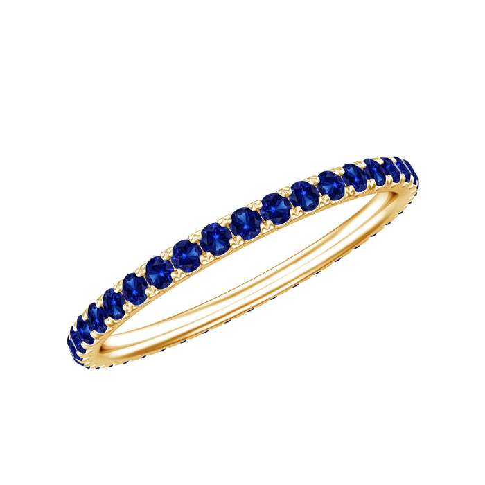 Lab grown blue sapphire eternity ring for women by Rosec Jewels, featuring a continuous row of vibrant blue sapphires.