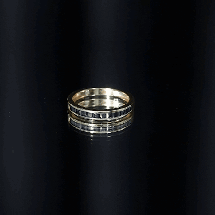 Princess cut black onyx half eternity ring in channel setting by Rosec Jewels, showcasing a sleek black gemstone band.