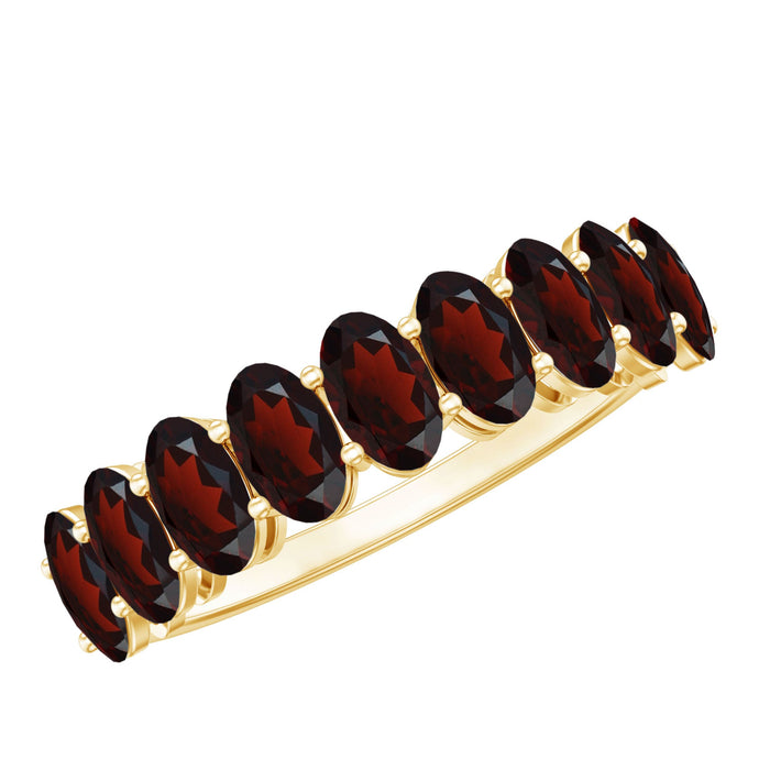 Genuine oval shape garnet half eternity ring by Rosec Jewels featuring a band with alternating garnet stones and precious metal.