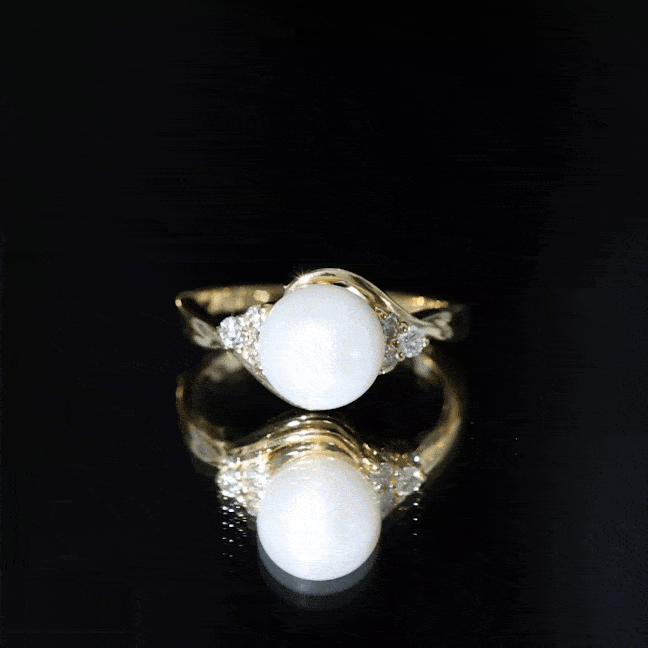 Natural 7.4 carat freshwater pearl engagement ring with diamond trio by Rosec Jewels, showcasing elegant white pearl and sparkling diamonds.