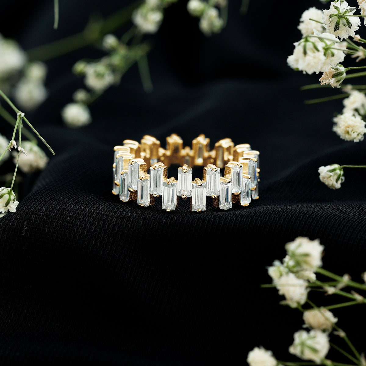 Rosec Jewels certified moissanite baguette eternity band ring featuring sparkling rectangular stones on a sleek gold band.
