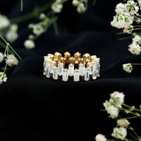 Rosec Jewels certified moissanite baguette eternity band ring featuring sparkling rectangular stones on a sleek gold band.