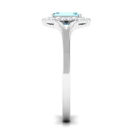 Emerald cut aquamarine engagement ring with diamond floral halo by Rosec Jewels, showcasing a sparkling center stone and intricate floral design