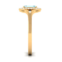 Emerald cut aquamarine engagement ring with diamond floral halo by Rosec Jewels, showcasing the detailed ring design and sparkling stones.