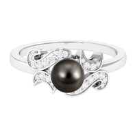 Tahitian pearl engagement ring with diamond and rose gold band from Rosec Jewels, showcasing a lustrous black pearl and sparkling diamond.