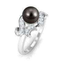 Elegant designer Tahitian pearl engagement ring with diamond accents from Rosec Jewels, showcasing the intricate band and lustrous pearl.