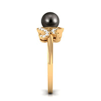 Elegant Tahitian pearl engagement ring with diamond accents by Rosec Jewels, showcasing a lustrous black pearl and sparkling diamonds.