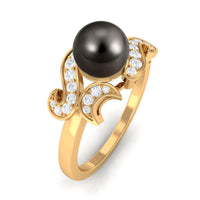Tahitian pearl engagement ring by Rosec Jewels featuring a central diamond and elegant band design.