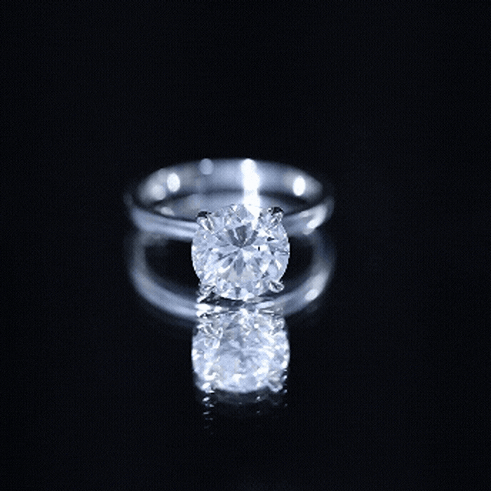 Yellow gold lab grown diamond solitaire engagement ring with a 3-carat certified diamond, featuring a sleek band and sparkling center stone.