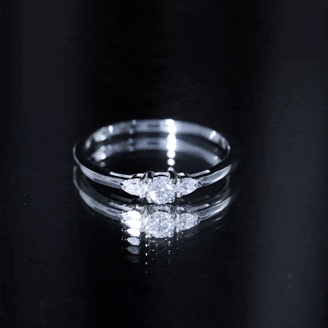 Three-stone moissanite promise ring in yellow gold by Rosec Jewels, showcasing sparkling gemstones and elegant band details.