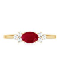 East West style 0.6 carat ruby oval promise ring with diamond accents from Rosec Jewels, showcasing the elegant design and gemstones.