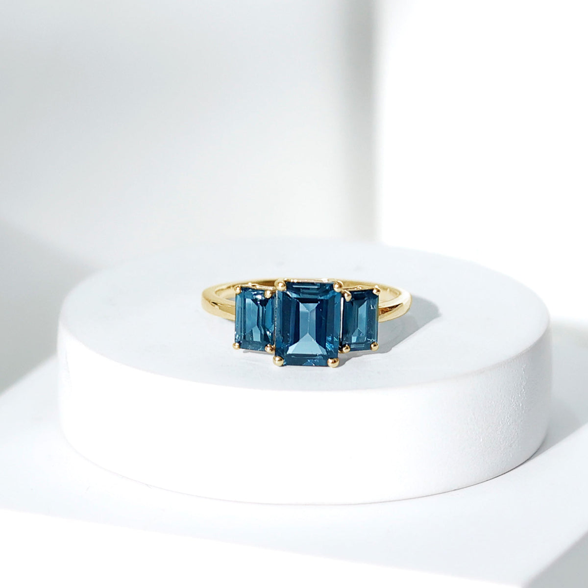 Emerald Cut London Blue Topaz Three Stone Engagement Ring