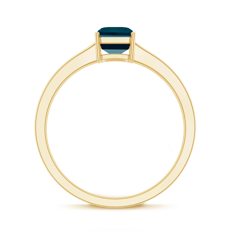 Rosec Jewels 6x8mm London Blue Topaz solitaire ring with emerald cut and certificate, showcasing the elegant gemstone and band.