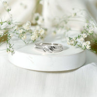 Certified diamond three stone men's band ring from Rosec Jewels, featuring a sleek silver design with sparkling diamonds.