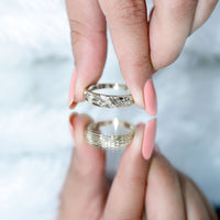 Certified diamond three stone men's band ring by Rosec Jewels featuring three sparkling diamonds on a sleek gold band.