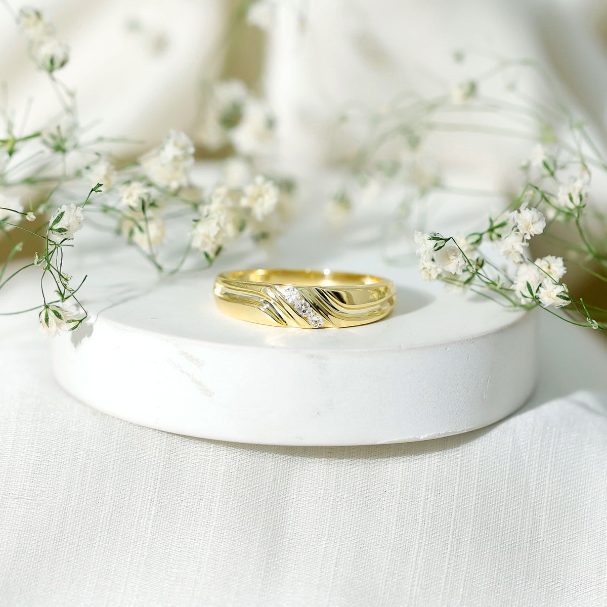 Certified diamond three-stone men's band ring from Rosec Jewels featuring a sleek silver band with three sparkling diamonds.