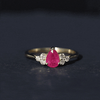 Pear-shaped natural 0.8 carat ruby engagement ring with diamond accents from Rosec Jewels, showcasing the elegant gemstone setting.