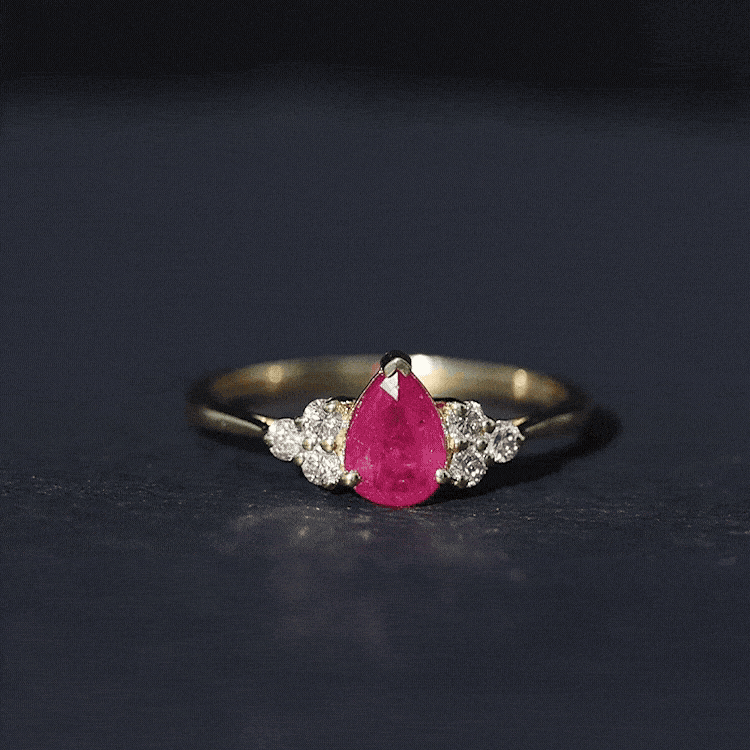 Pear-shaped 0.8 carat ruby engagement ring with diamonds from Rosec Jewels, featuring a natural ruby and sparkling diamond accents.