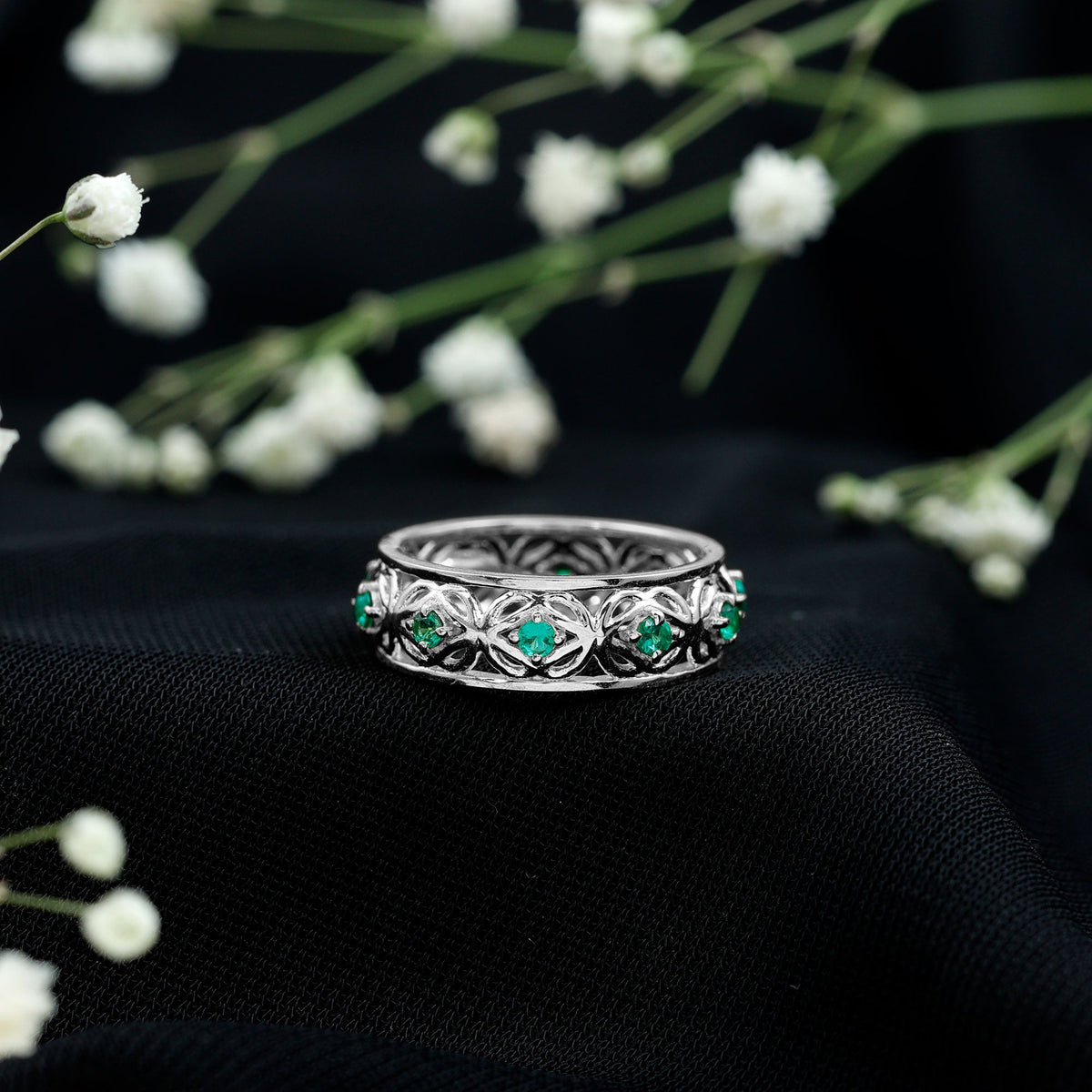 Vintage-looking lab-grown emerald wedding band for women by Rosec Jewels, featuring intricate design and rich green emerald details.