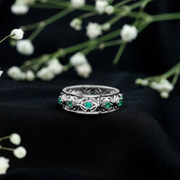 Vintage-looking lab-grown emerald wedding band for women by Rosec Jewels, featuring intricate design and rich green emerald details.