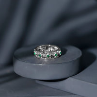 Vintage-looking lab-grown emerald wedding band for women by Rosec Jewels, featuring intricate design and vibrant green emeralds.
