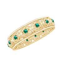 Vintage-looking lab grown emerald wedding band for women in a rose gold finish, featuring intricate detailing and a classic design.