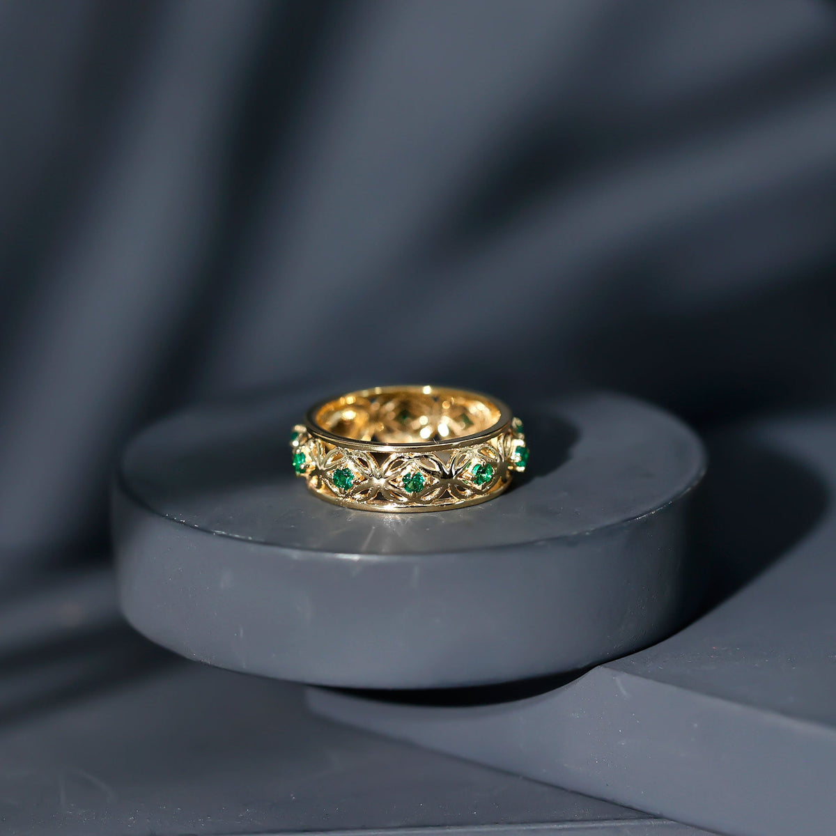 Vintage-looking lab grown emerald wedding band for women, featuring intricate design and vibrant green emeralds, by Rosec Jewels.