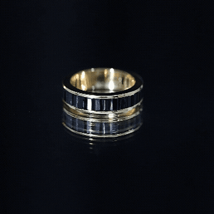 Black onyx wedding band by Rosec Jewels featuring baguette cut stones in a channel setting, showcasing elegant ring design.