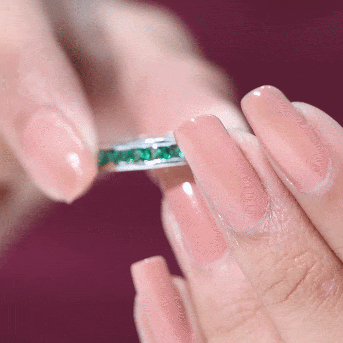Yellow gold ring featuring a channel set princess cut lab-grown emerald half eternity design from Rosec Jewels.
