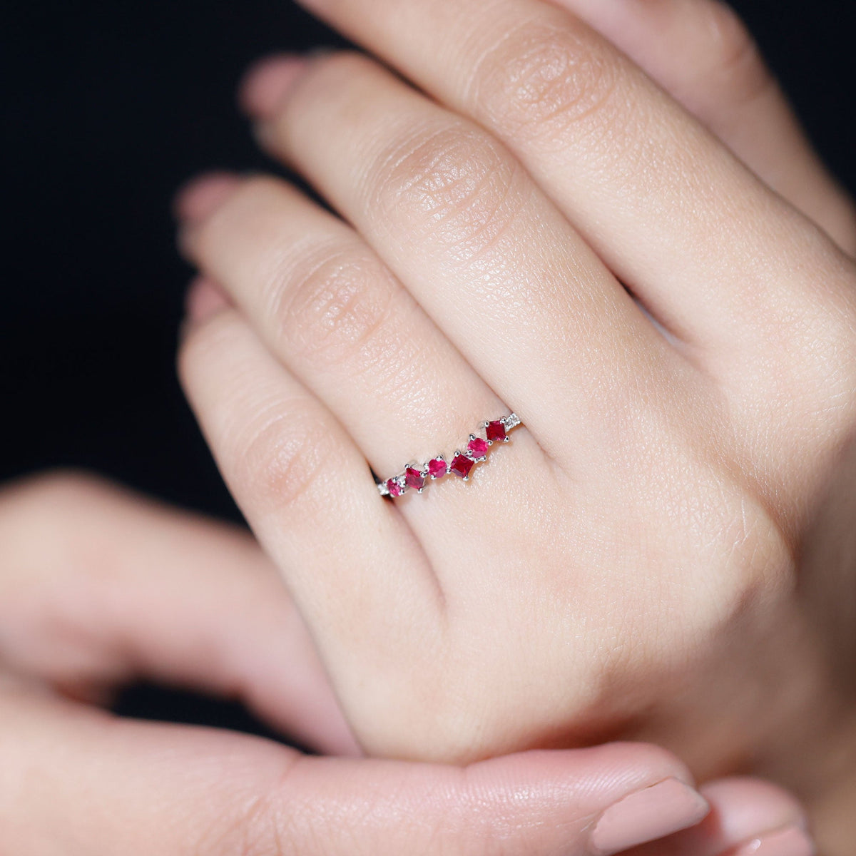 Lab grown ruby and diamond half eternity ring by Rosec Jewels featuring alternating gemstones and a sleek gold band.