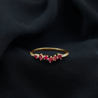Lab grown ruby and diamond half eternity ring by Rosec Jewels, featuring a band with alternating gemstones and intricate metalwork.