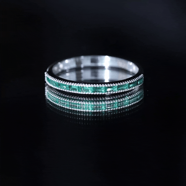 Lab grown emerald eternity ring with baguette cut stones and beaded detailing, crafted by Rosec Jewels.
