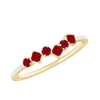 Rosec Jewels minimal ruby half eternity ring with diamond, featuring a sleek gold band and sparkling gemstones.