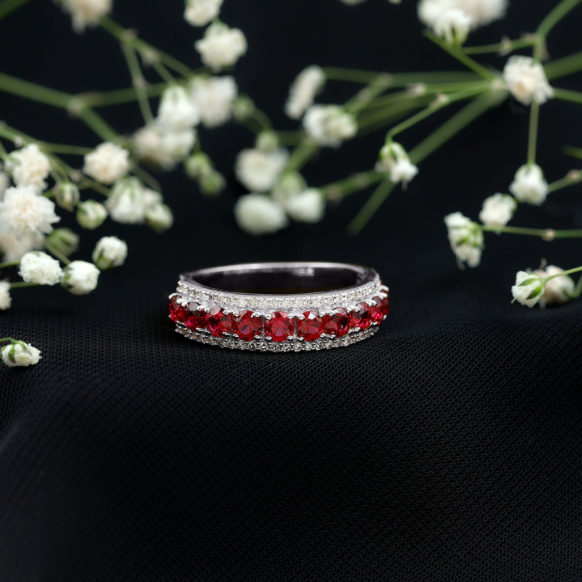 Lab-created ruby and diamond wedding anniversary ring by Rosec Jewels featuring a band with vibrant red rubies and sparkling diamonds.