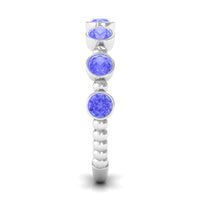 Natural Tanzanite Half Eternity Ring in Bezel Setting