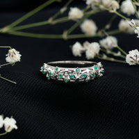 Natural emerald filigree wedding band for women featuring intricate gold detailing, crafted by Rosec Jewels.
