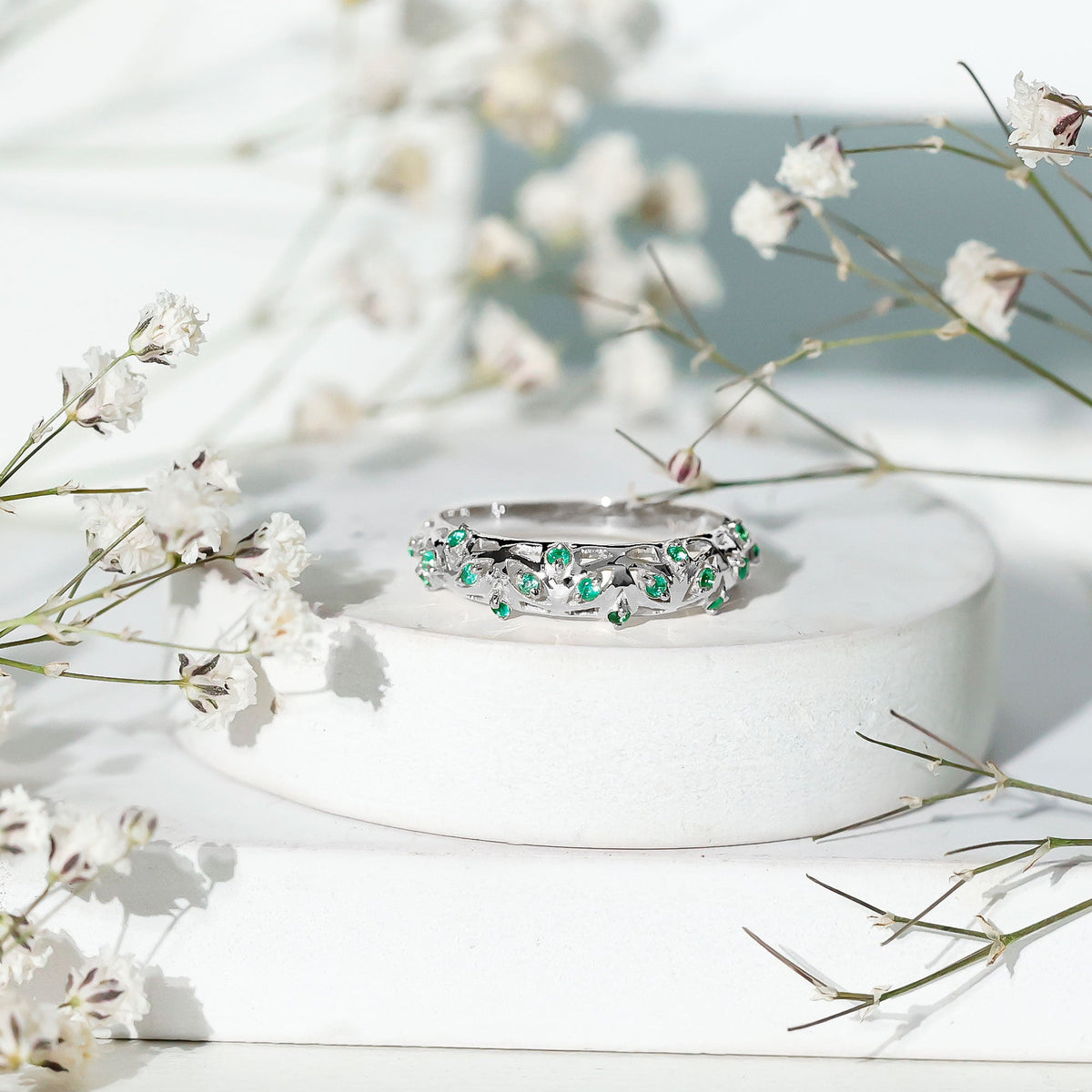 Natural emerald filigree wedding band for women by Rosec Jewels, featuring intricate gold filigree detailing and a central emerald gemstone.