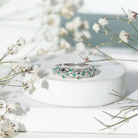Natural emerald filigree wedding band for women by Rosec Jewels, featuring intricate gold filigree detailing and a central emerald gemstone.