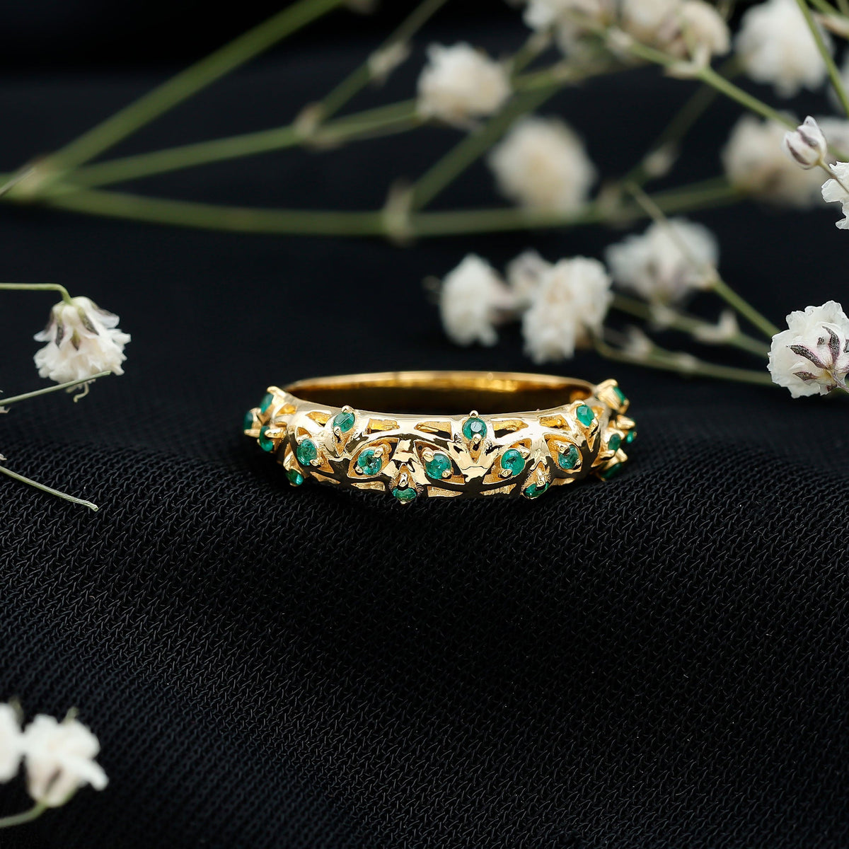 Natural emerald filigree wedding band for women, crafted by Rosec Jewels, featuring intricate gold filigree design and vibrant green emeralds.
