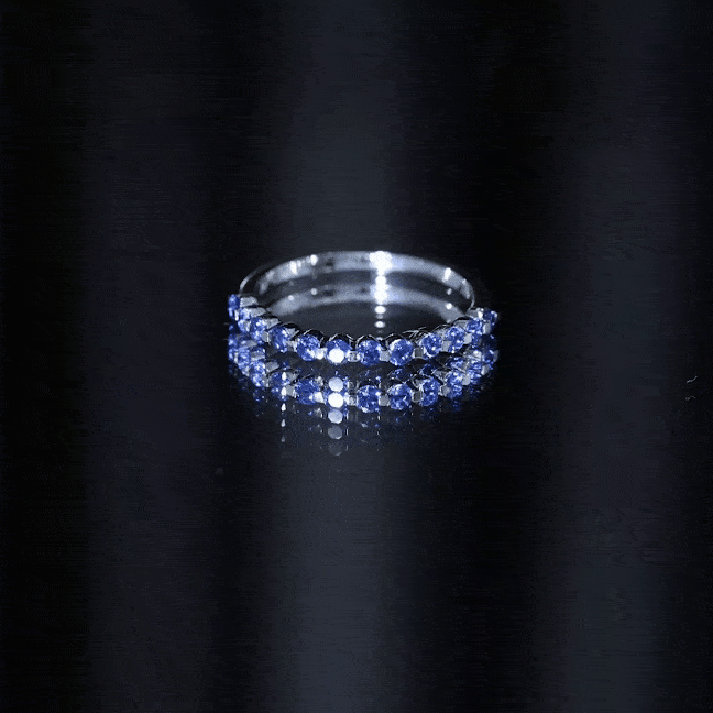 Certified lab-grown blue sapphire half eternity ring for women by Rosec Jewels, featuring a band of vibrant blue sapphires.