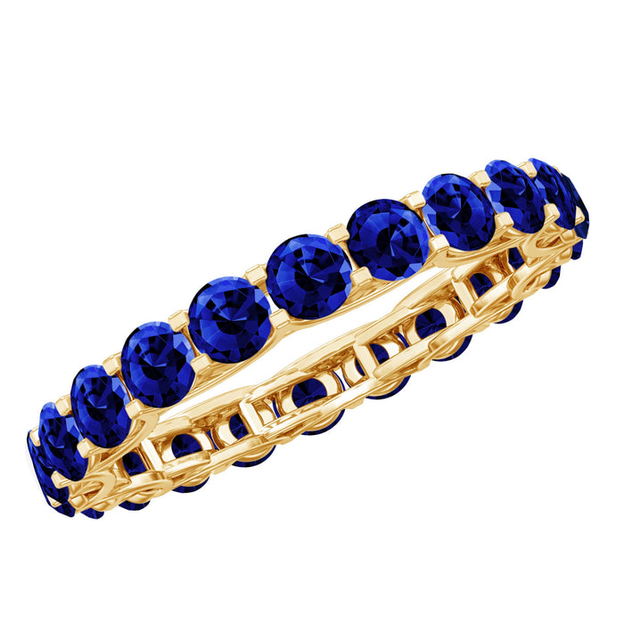 Round Lab Grown Blue Sapphire full eternity band ring by Rosec Jewels, showcasing a continuous circle of sparkling blue sapphires.