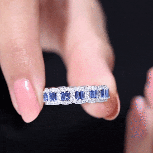 Lab-grown blue sapphire eternity wedding band with diamonds from Rosec Jewels, showcasing a continuous row of sparkling stones.