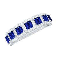 Lab-grown blue sapphire eternity wedding band by Rosec Jewels featuring diamonds and a sleek silver-tone ring design.