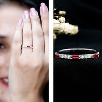 Lab grown ruby eternity ring with baguette cut rubies and small diamonds, vintage style, by Rosec Jewels.