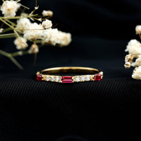 Lab grown ruby eternity ring by Rosec Jewels featuring baguette-cut ruby and diamond accents in a vintage style.