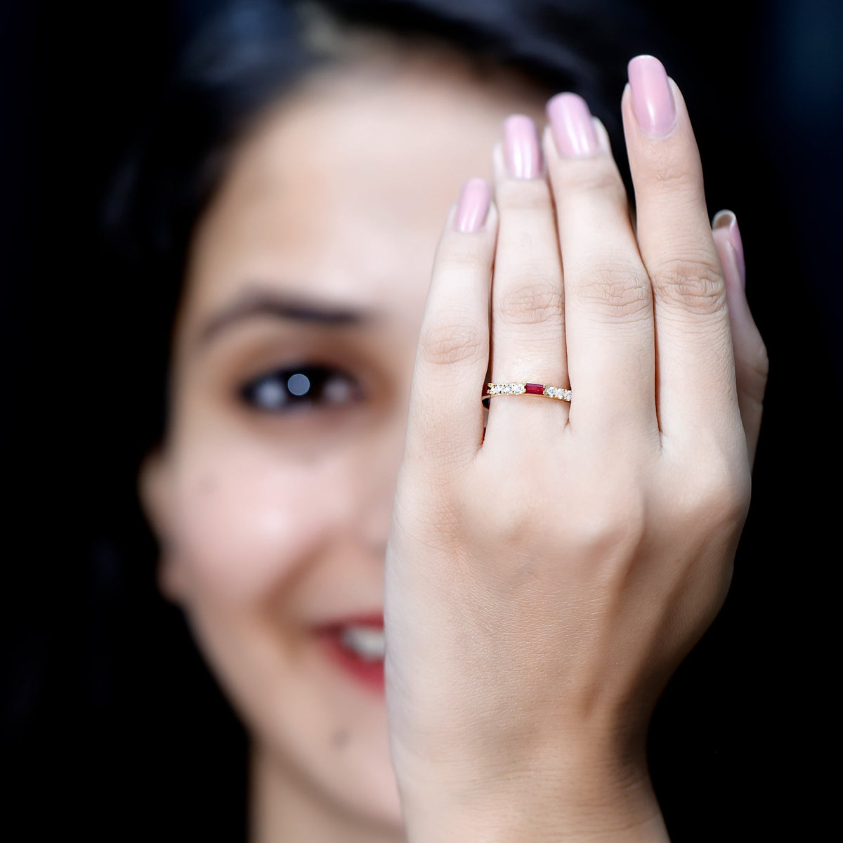 Rosec Jewels baguette cut lab-grown ruby vintage eternity ring with diamond accents, showcasing elegant gemstone and band details.